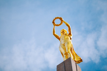 Monument of Remembrance Gelle Fra or Golden Lady is a war - obrazy, fototapety, plakaty