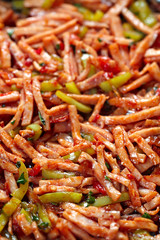 Fried meat with corn on pita bread.