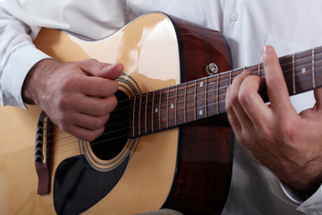 Fototapeta na wymiar Man playing the acoustic guitar
