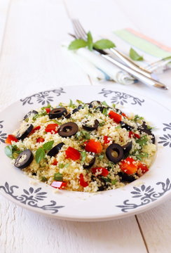 Tabbouleh salad with olives and red pepper