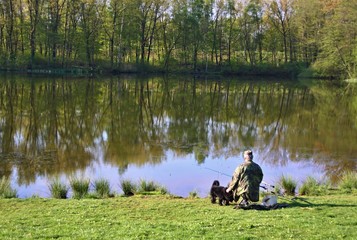 Obraz na płótnie Canvas fisherman with a dog
