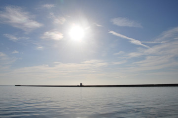 distant pier blue sea and sky