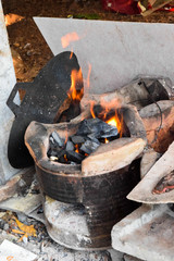 Fototapeta na wymiar Fire on cooker with charcoal