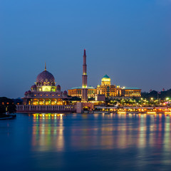 Fototapeta na wymiar Reflection of Putra Mosque and Prime Minister Office at dusk in Putrajaya, Malaysia.