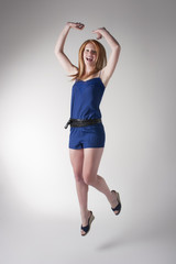 Model in blue jumpsuit jumping