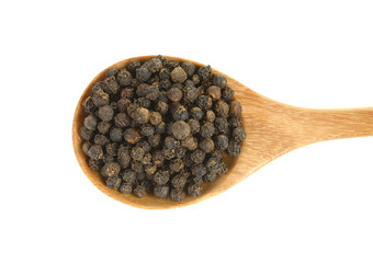 black pepper in wooden spoon isolated on white