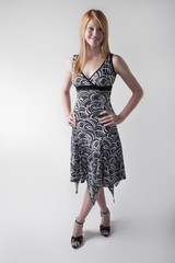 Smiling model in a black and white dress