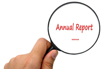 Annual Report word. Magnifier and puzzles.