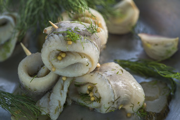 Pickled rollmops herrings with dill
