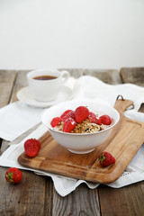 Homemade granola with milk and strawberries 
