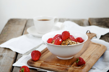 Homemade granola with milk and strawberries 
