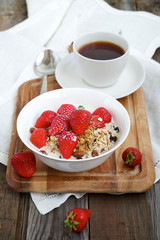Homemade granola with milk and strawberries 
