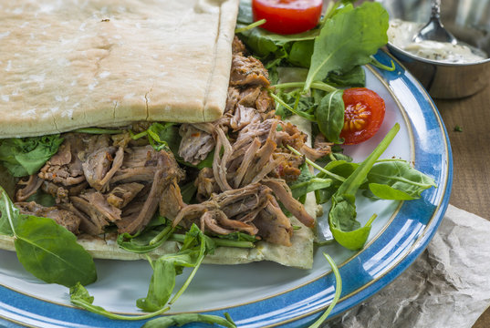 Pulled Lamb With Fresh Rocket Salad And Pitta Bread