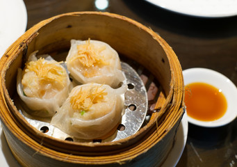 dim sum in bamboo steam containers