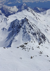Fototapeta na wymiar beautiful rocky peaks of the mountains in the snow