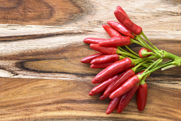 red chilies on wood background