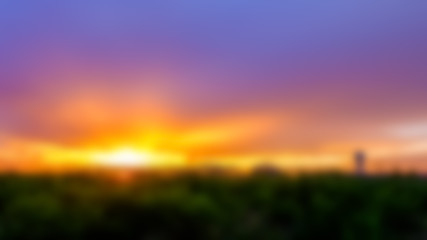 abstract blurred background of sunrise over factory