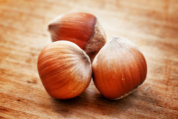 Hazelnuts on old wooden table, selective fokuks