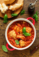 Baked rabbit in tomato sauce with rosemary and basil. Italian Cuisine.