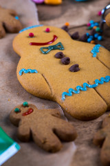 Decorating homemade gingerbread man for Christmas
