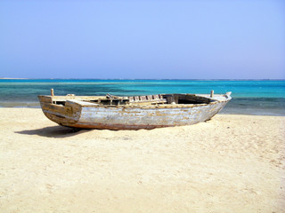 Fototapeta na wymiar Wreck of Old Fishing Boat on Beach