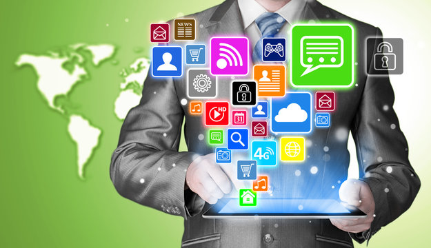 Business man using tablet PC with social media icon set