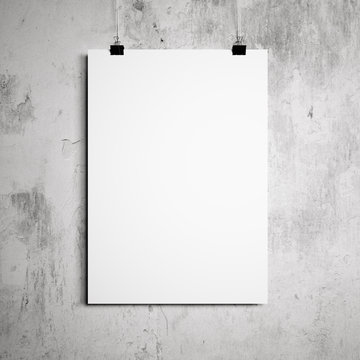 blank poster hanging on a white background painted walls