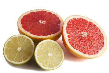 Fresh lime and grapefruit cut in half.