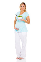 pregnant woman on diet eating salad