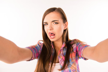 Fototapeta premium girl making selfie and showing her tonge