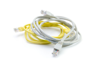 Fototapeta premium Close up of network cable and plugs on white background