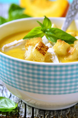 Pumpkin creamy soup with chicken and homemade croutons.