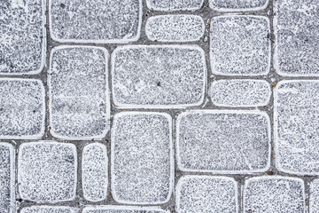 Grunge white paint pavement blocks.