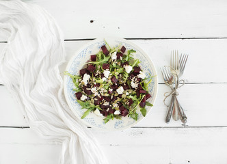 Beetroot salad with arugula, feta cheese, red salt and pumpkin