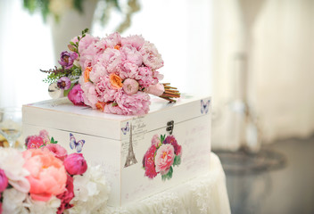 Arrangement of pink and white flowers in restaurant for luxury wedding event