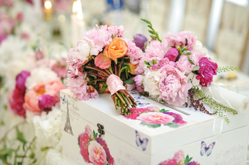 Arrangement of pink and white flowers in restaurant for luxury wedding event
