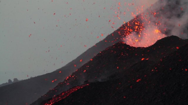 Lava explosion at dawn. Mount Etna eruption