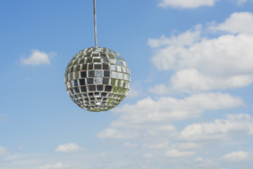 Mirror ball with a background as a beautiful sunny sky.