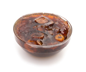 glass bowl of Chinese traditional medical jujube soup on white background