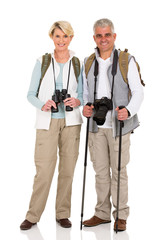 mid age couple standing on white