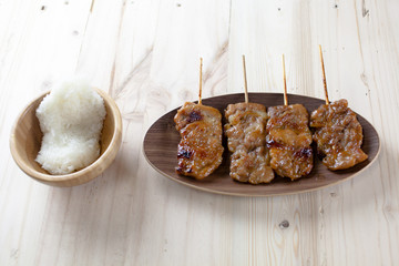 Thai-styled grilled pork and sticky rice. It's among most popular street foods in Thailand.