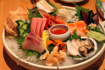 A colorful platter of sashimi sushi ..