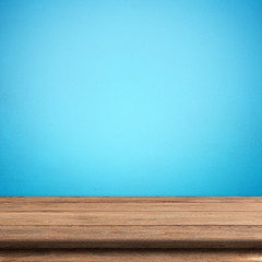 Vintage wood table in blue wall room.