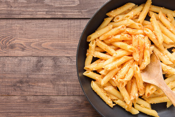 Penne pasta with tomato sauce in a pan