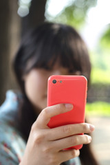 Asian girl use smartphone taking photo
