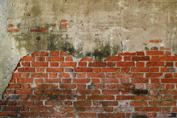 The old cracked wall of the abandoned ruins.