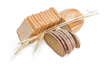 Various bakery products and wheat spikelets on a light backgroun