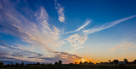 Sunset in the countryside with cirrus clouds