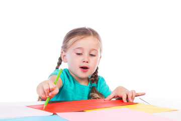 girl draws at the table