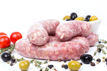 uncooked raw sausages with serving spices